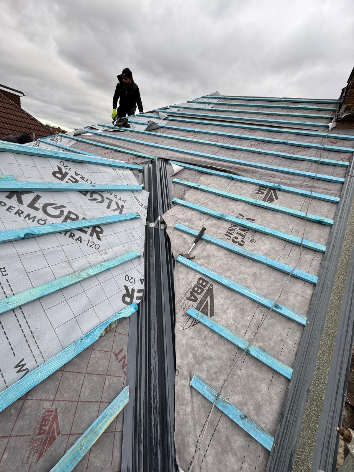 Professional roofers working on a property in London - KS Roof Master