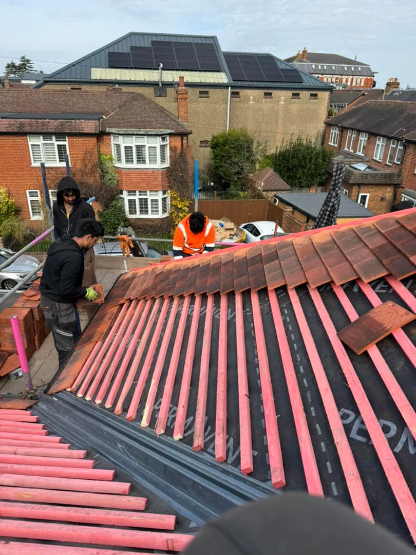 Professional roofers working on a property in London - KS Roof Master