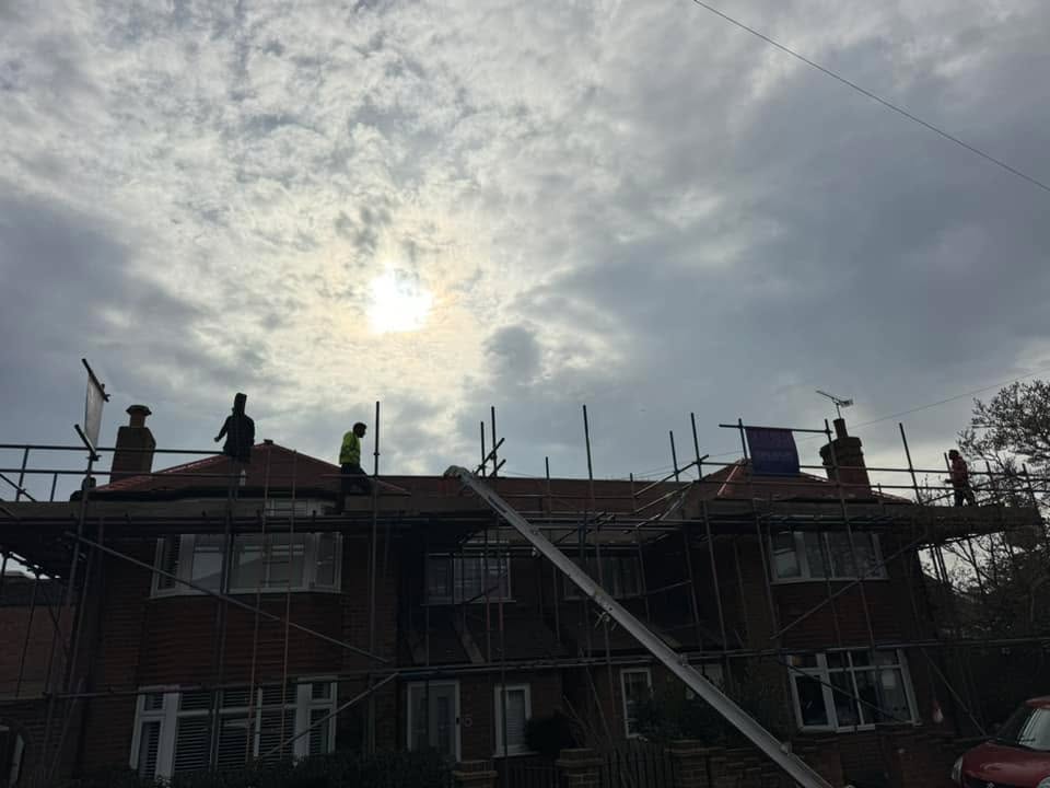 Professional roofers working on a property in London - KS Roof Master