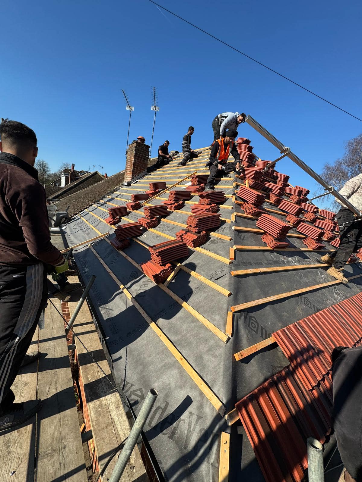 Professional roofers working on a property in London - KS Roof Master