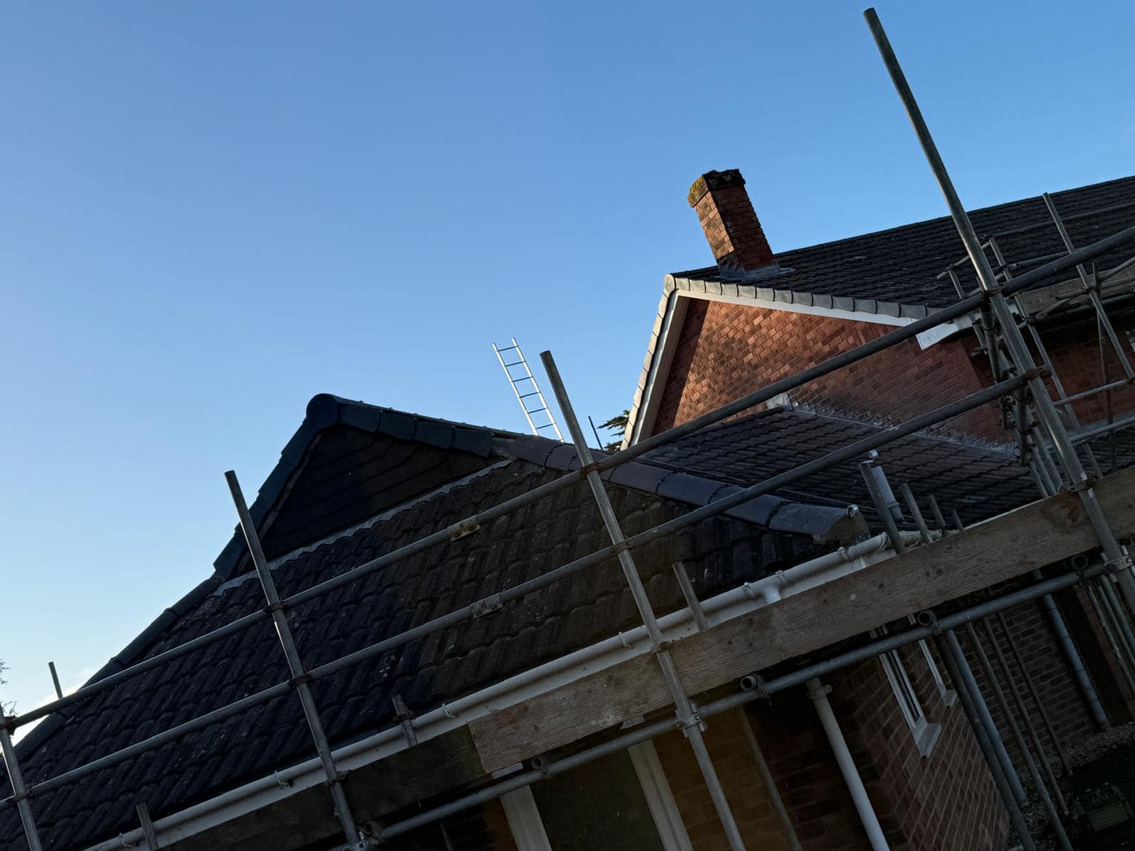 Professional roofers working on a property in London - KS Roof Master