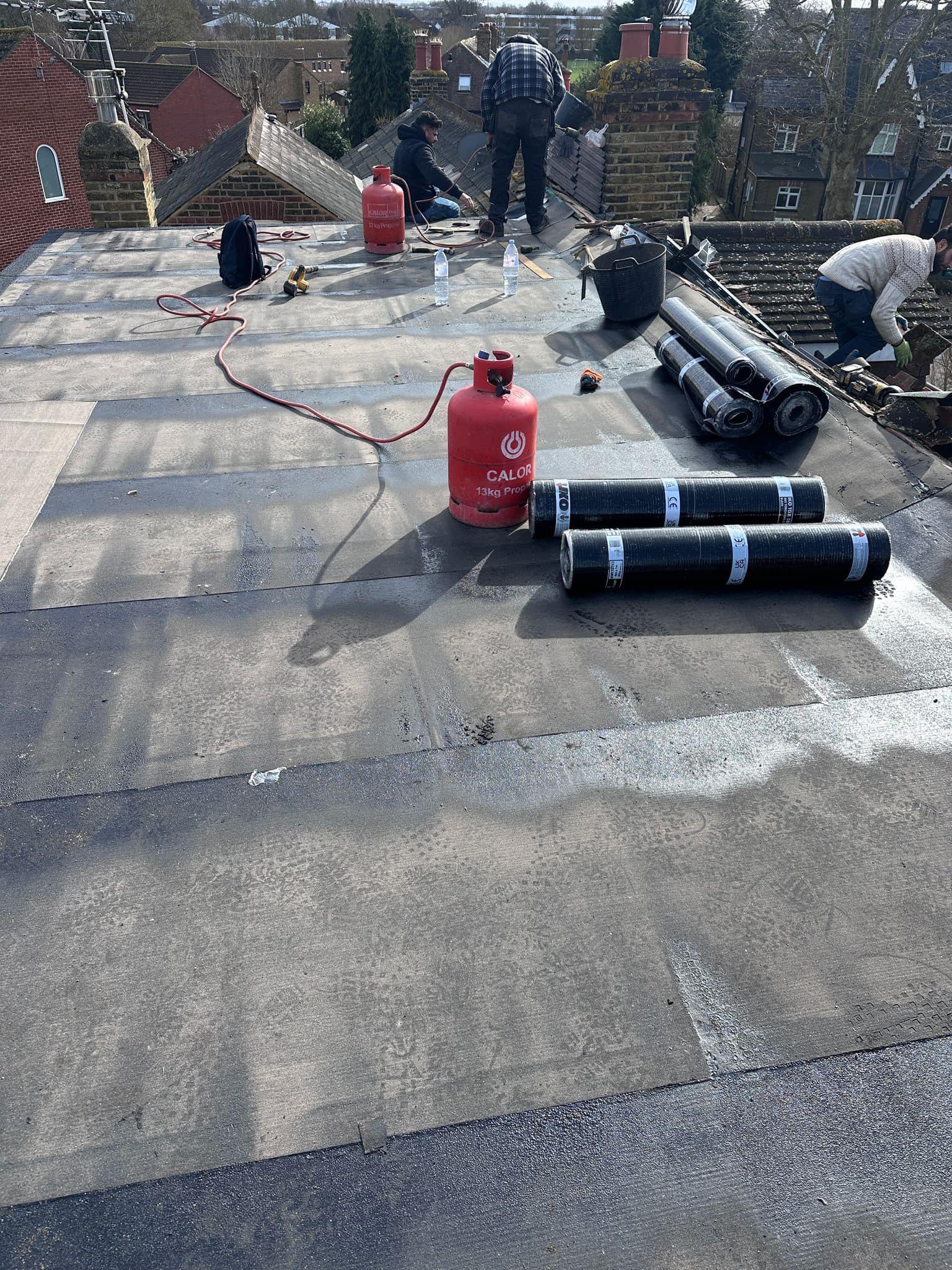 Professional roofers working on a property in London - KS Roof Master