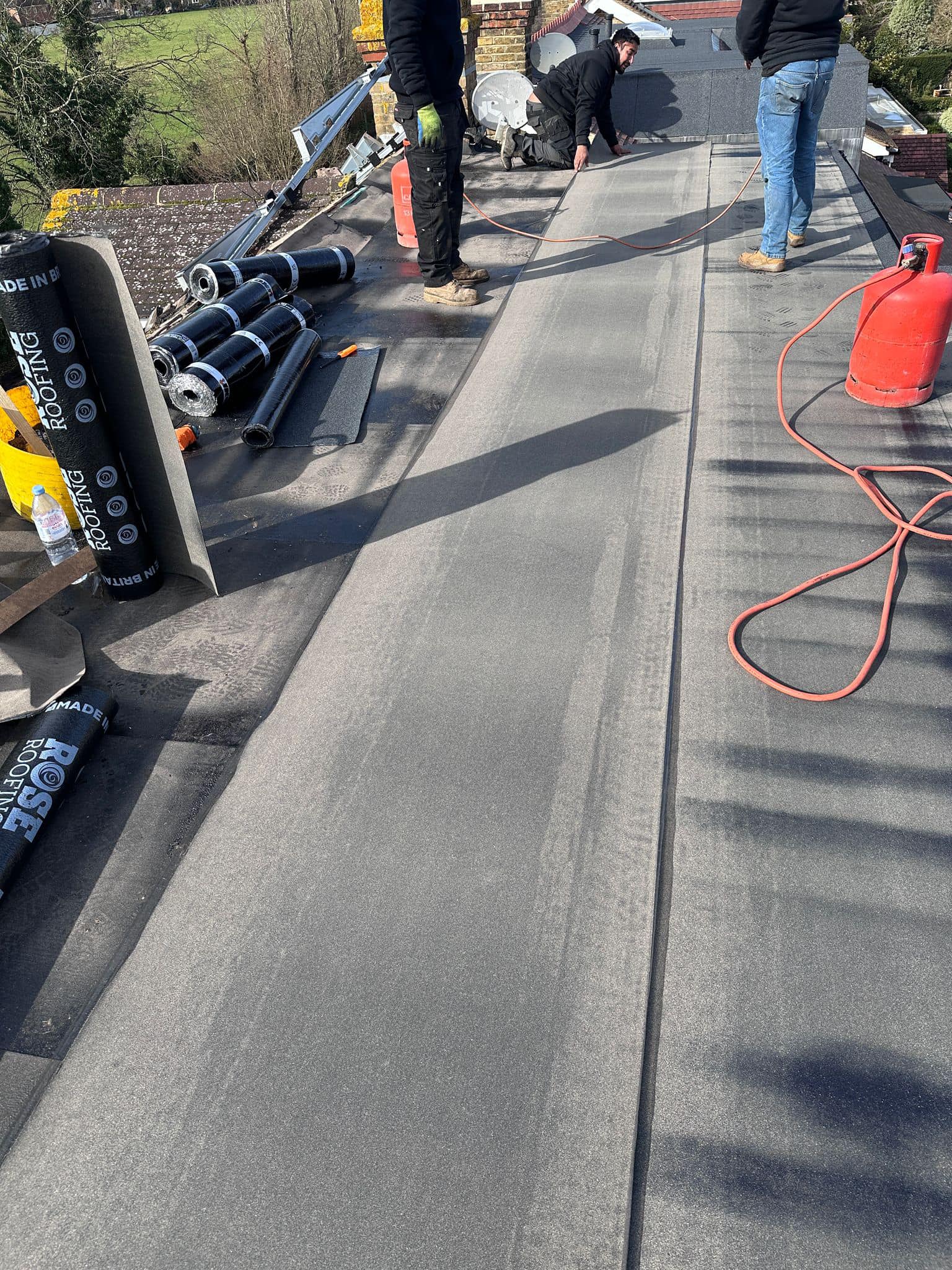 Professional roofers working on a property in London - KS Roof Master