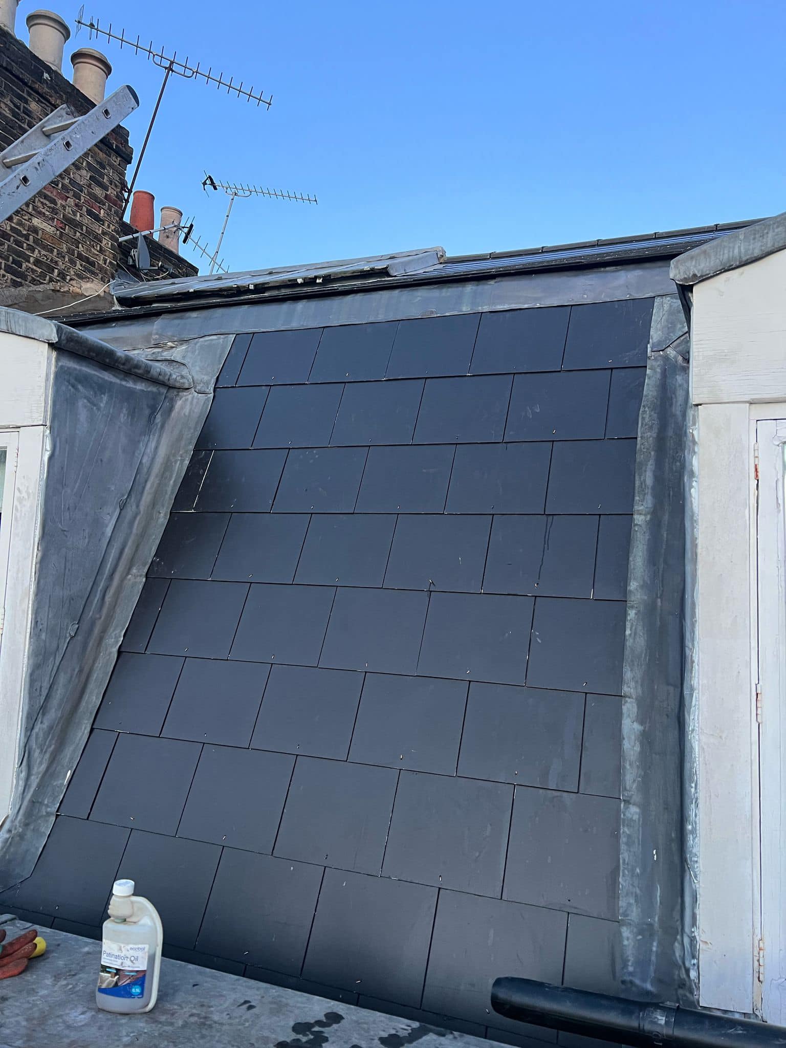 Professional roofers working on a property in London - KS Roof Master