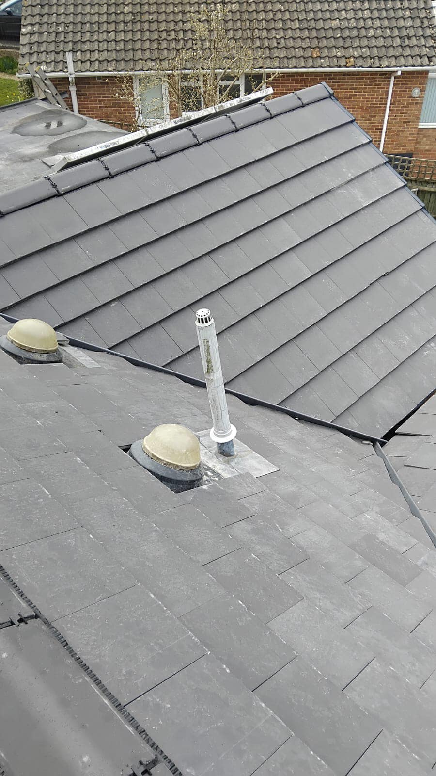 Professional roofers working on a property in London - KS Roof Master