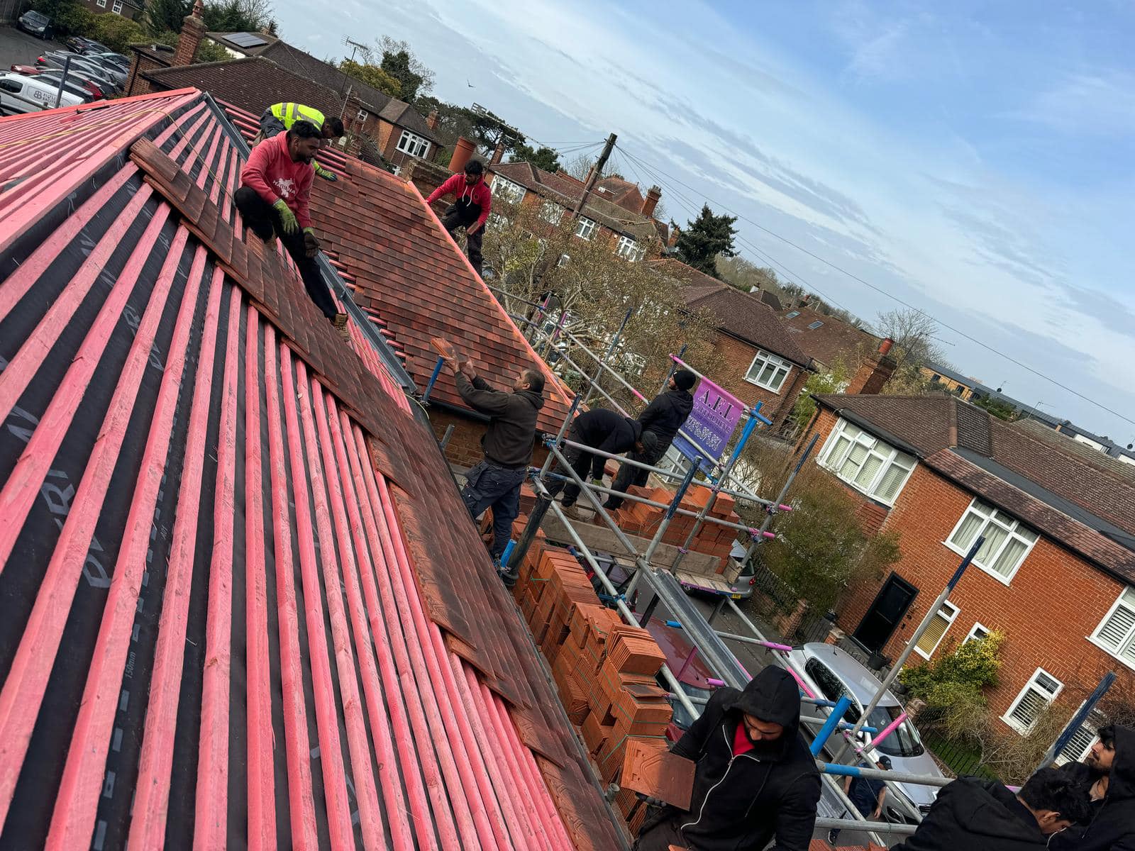 Professional roofers working on a property in London - KS Roof Master