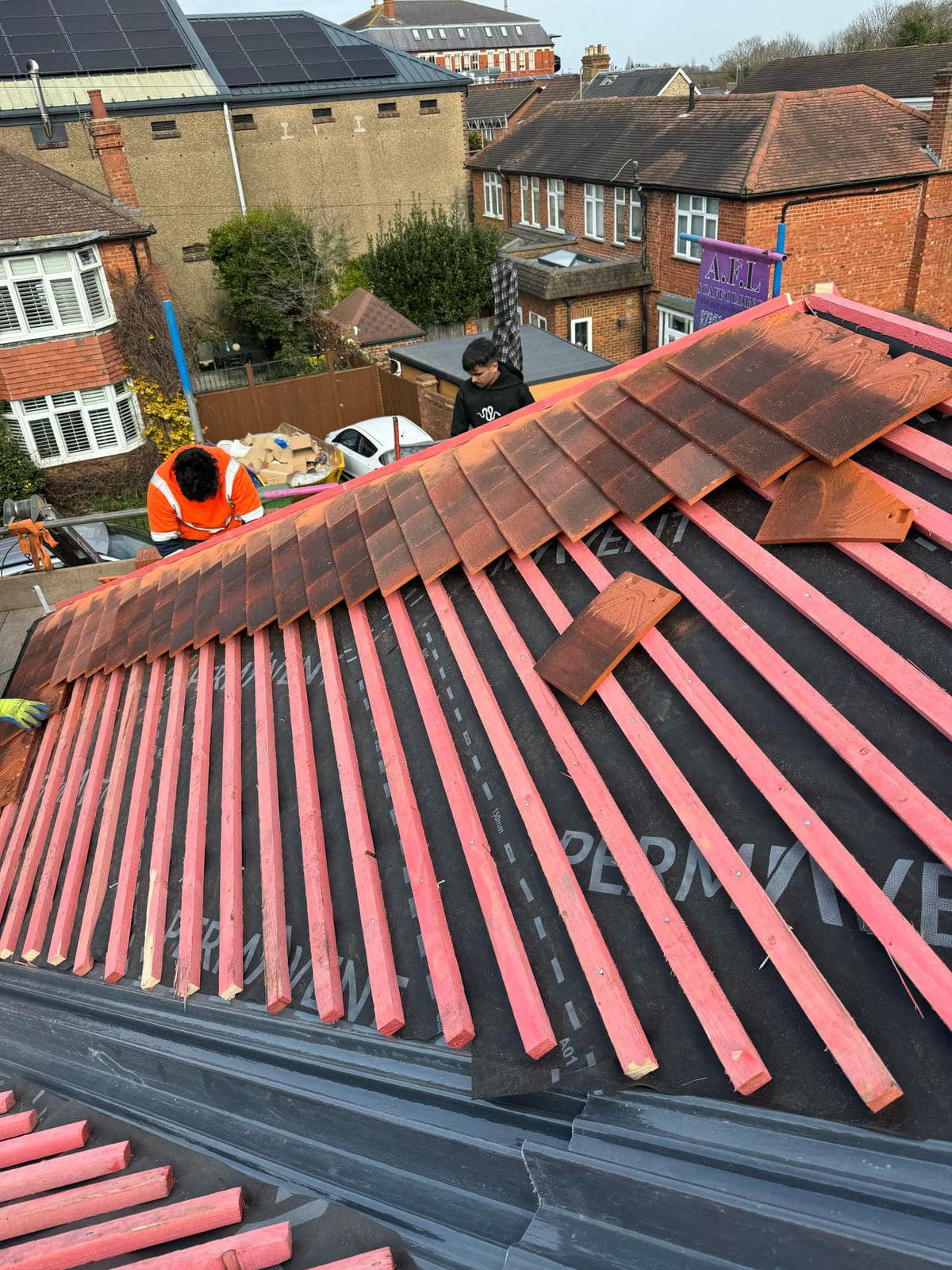 Professional roofers working on a property in London - KS Roof Master