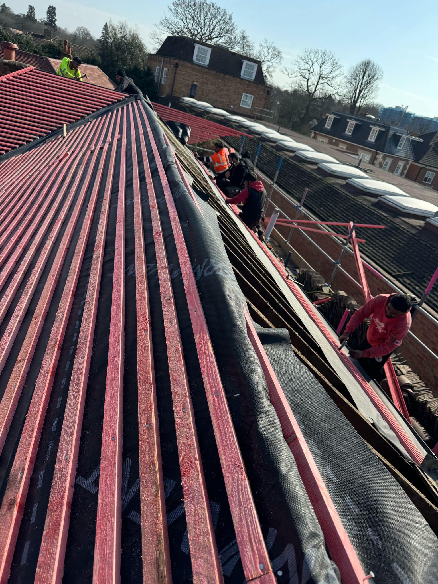 Professional roofers working on a property in London - KS Roof Master