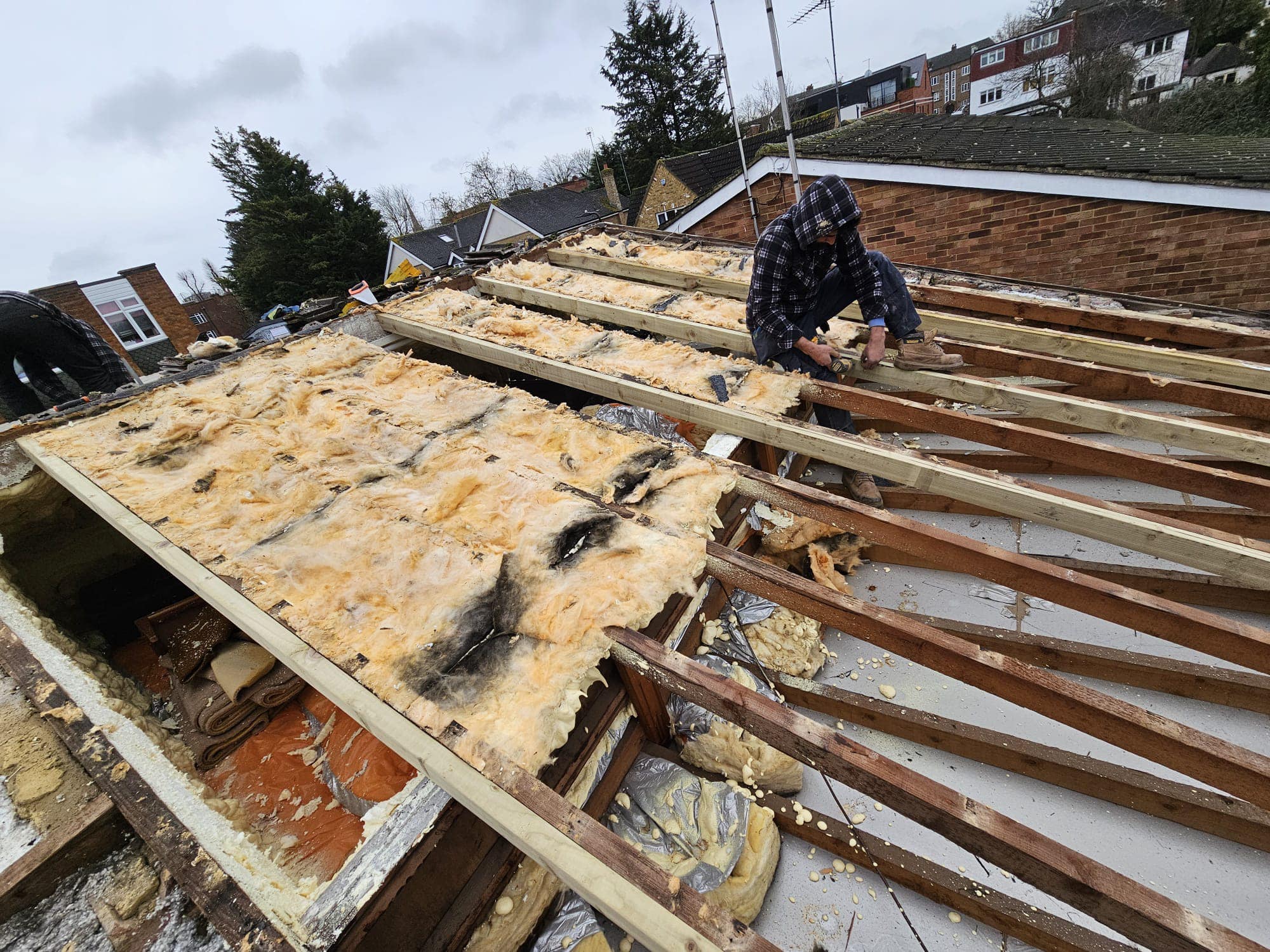 Professional roofers working on a property in London - KS Roof Master