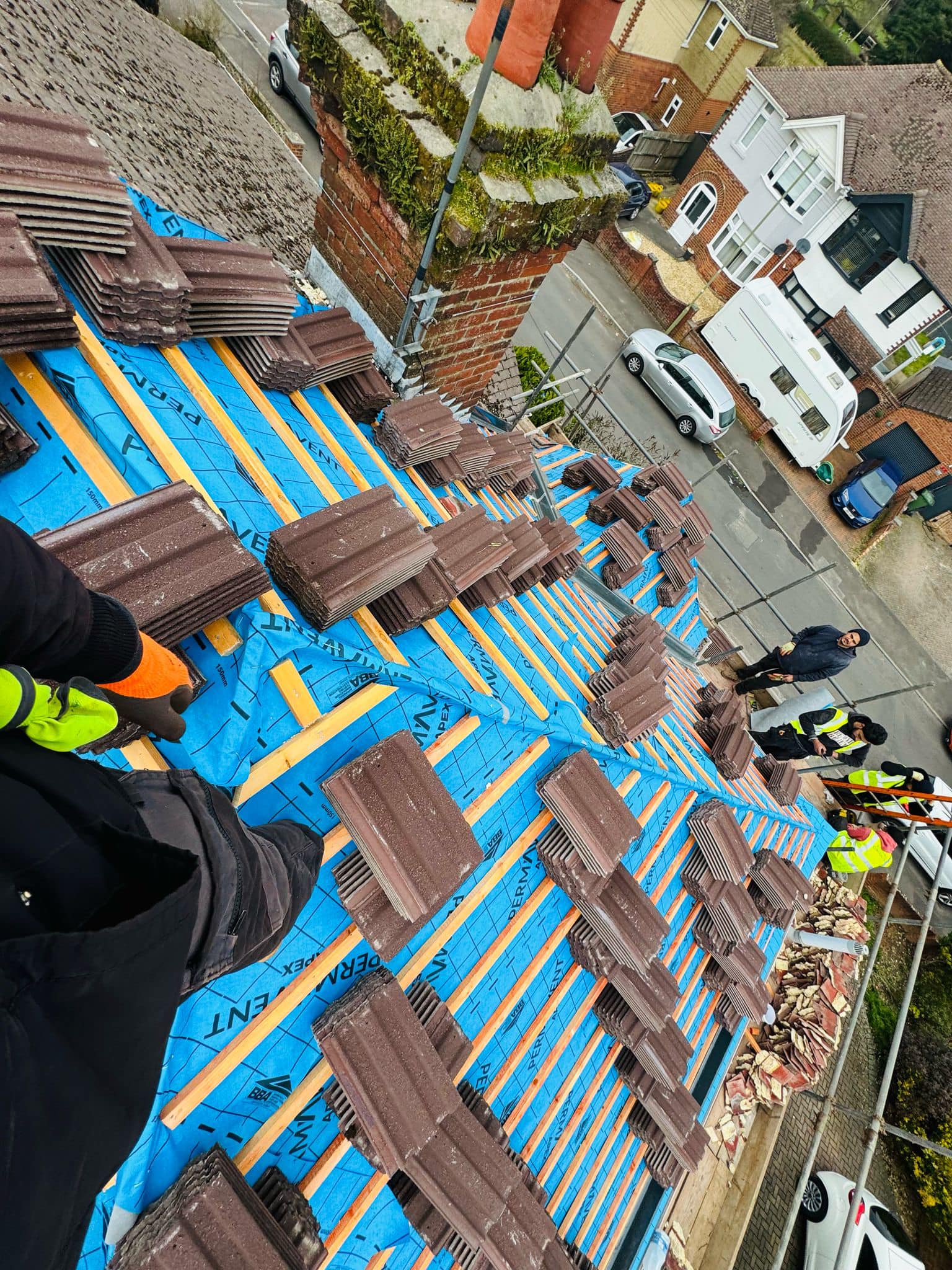 Professional roofers working on a property in London - KS Roof Master