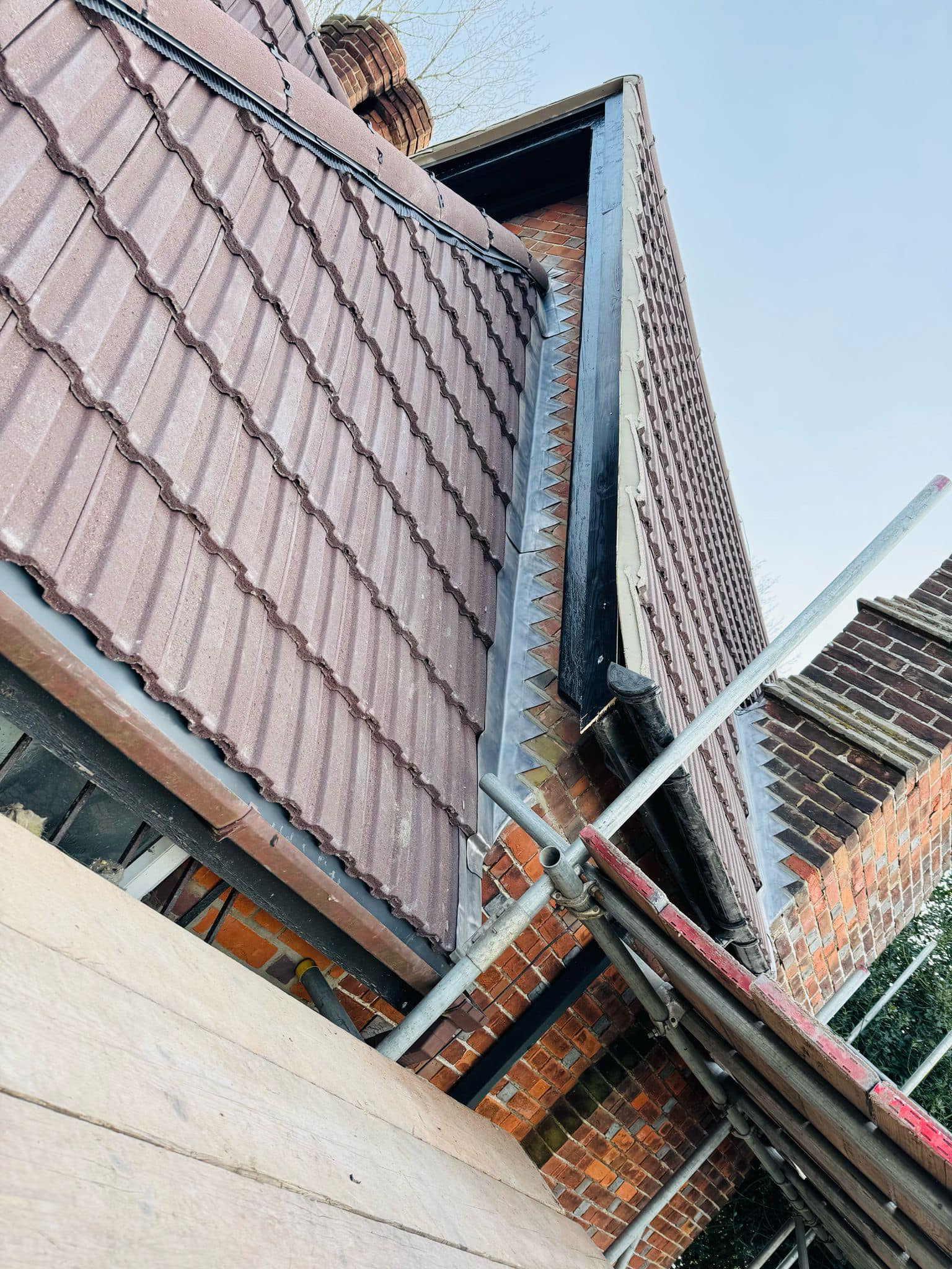 Professional roofers working on a property in London - KS Roof Master