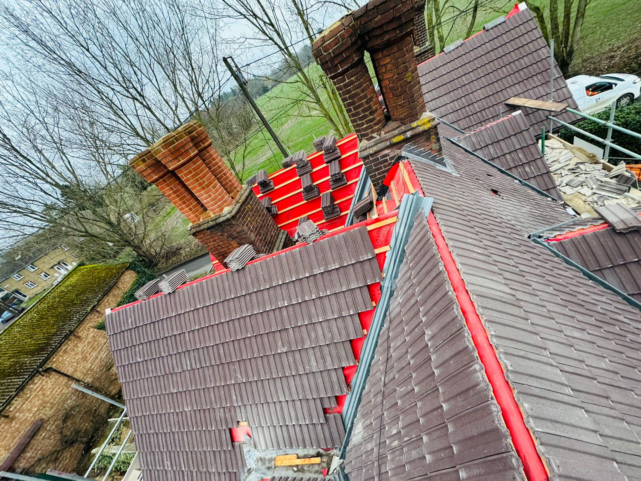 Professional roofers working on a property in London - KS Roof Master