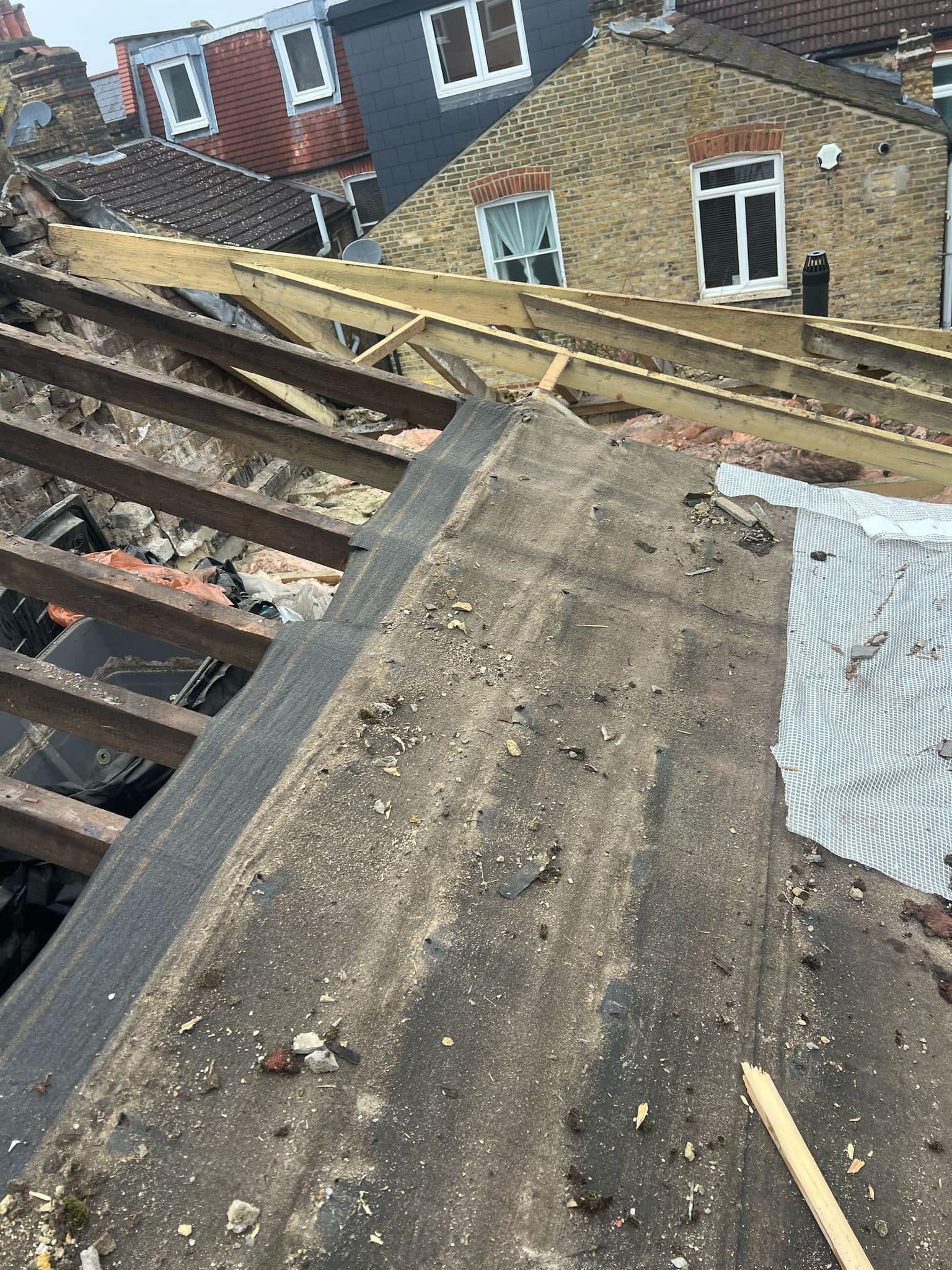 Professional roofers working on a property in London - KS Roof Master