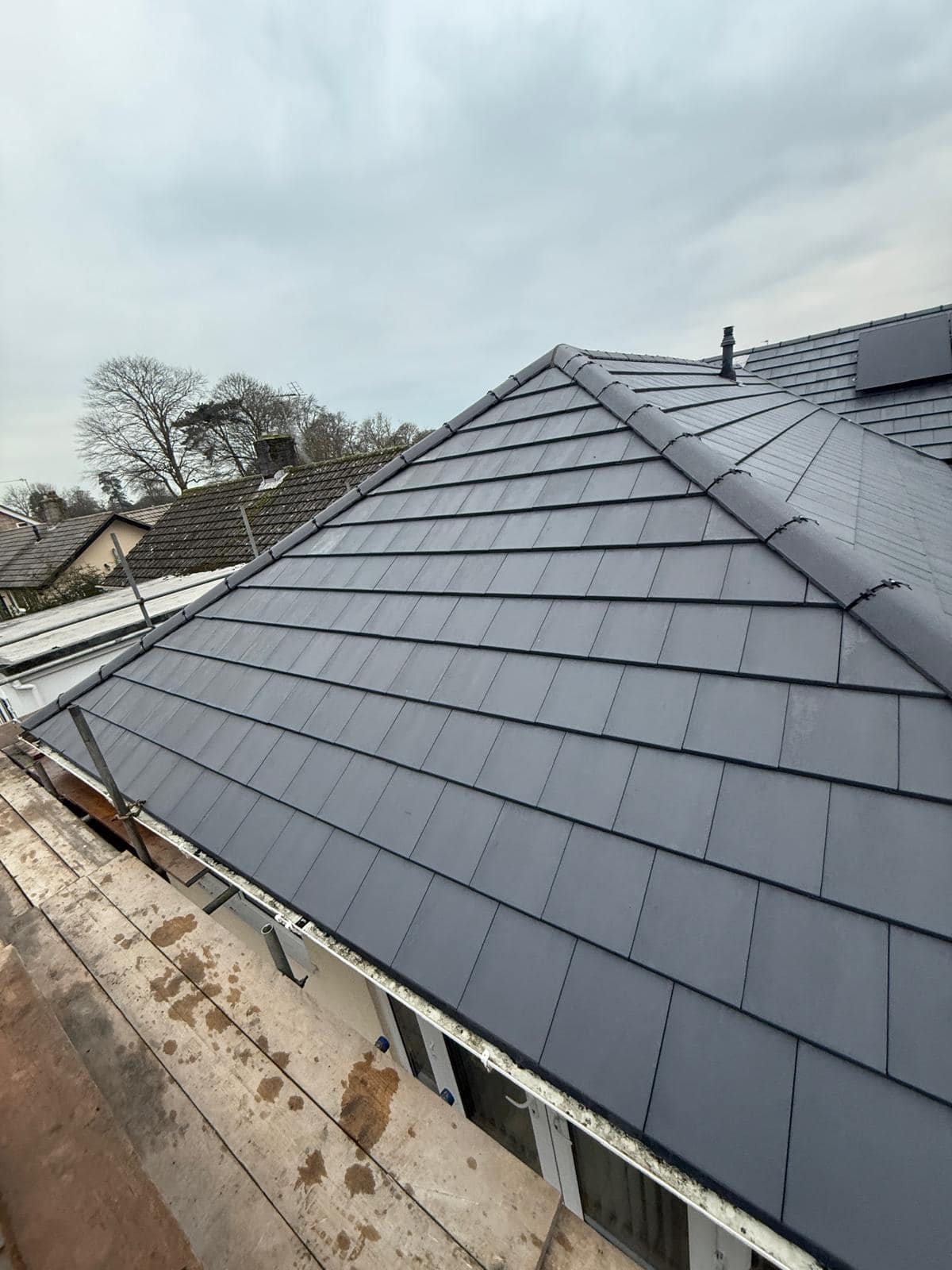 Professional roofers working on a property in London - KS Roof Master