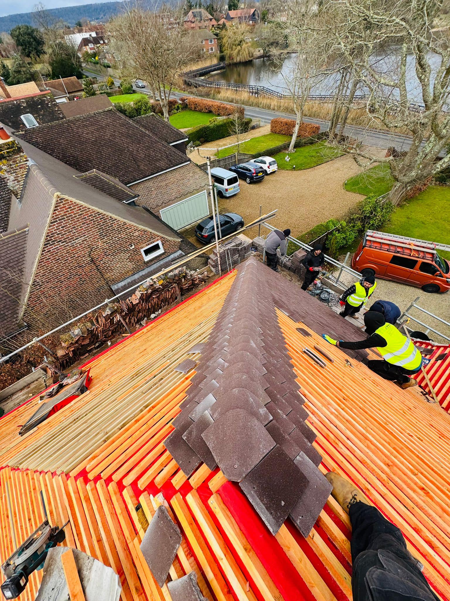 Professional roofers working on a property in London - KS Roof Master