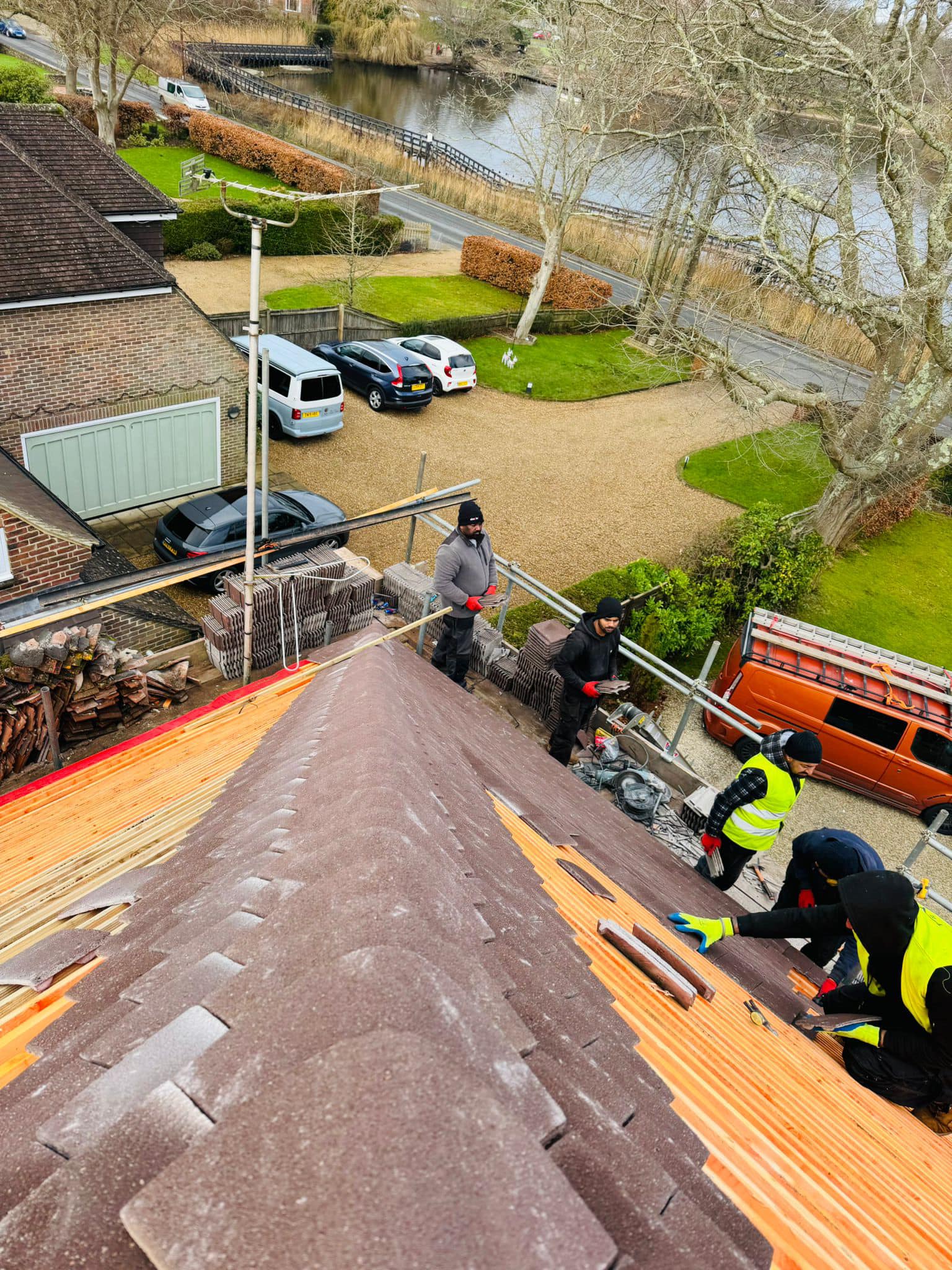 Professional roofers working on a property in London - KS Roof Master