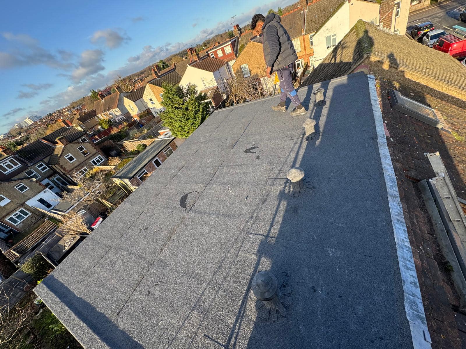 Professional roofers working on a property in London - KS Roof Master