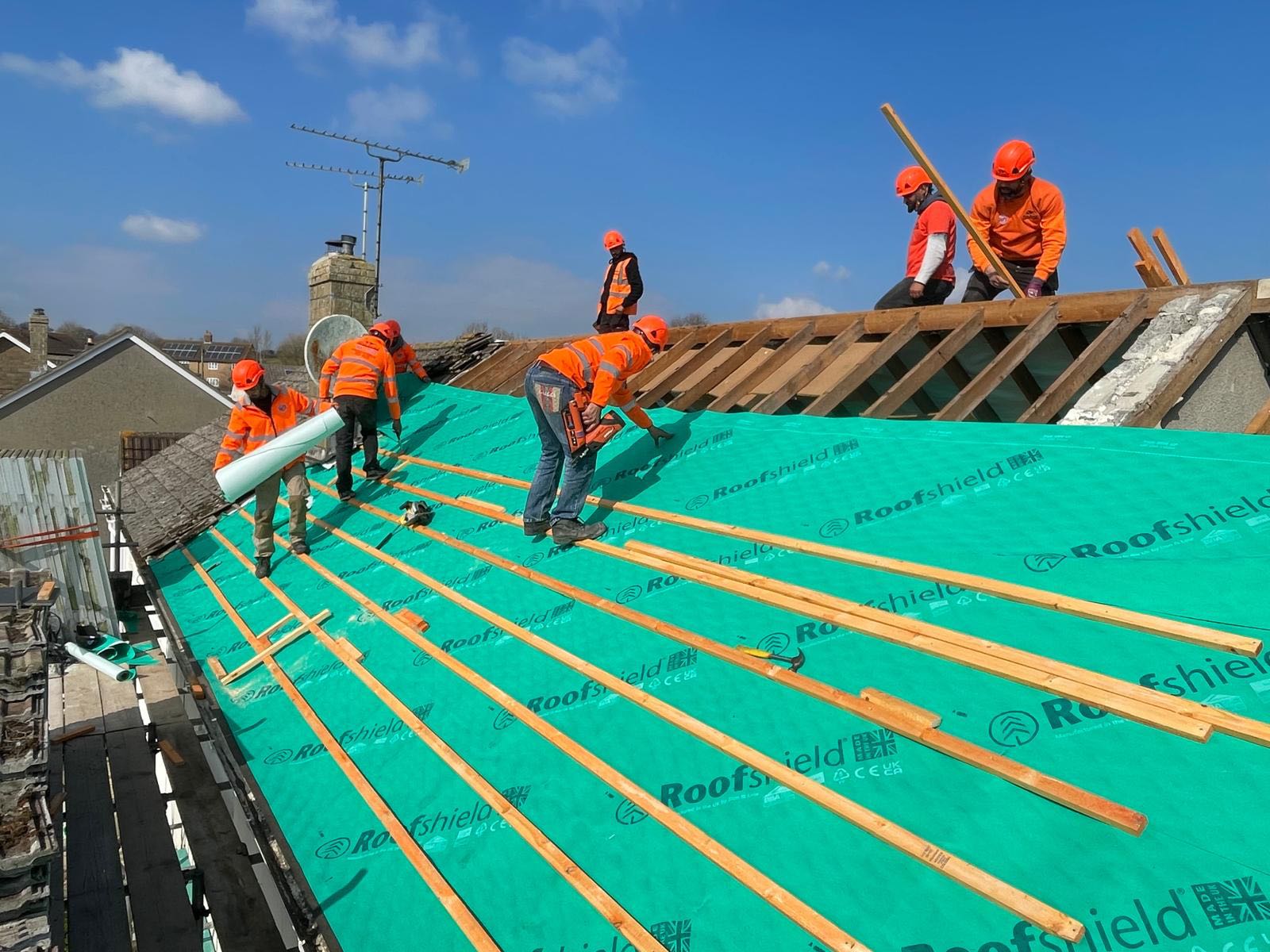 Professional roofers working on a property in London - KS Roof Master