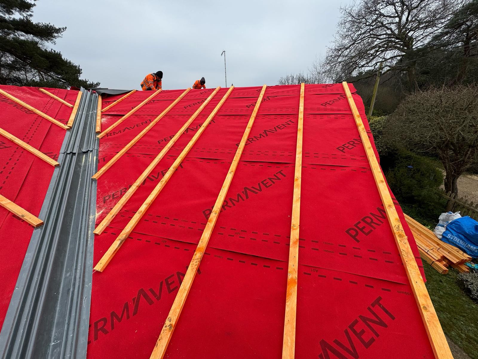 Professional roofers working on a property in London - KS Roof Master