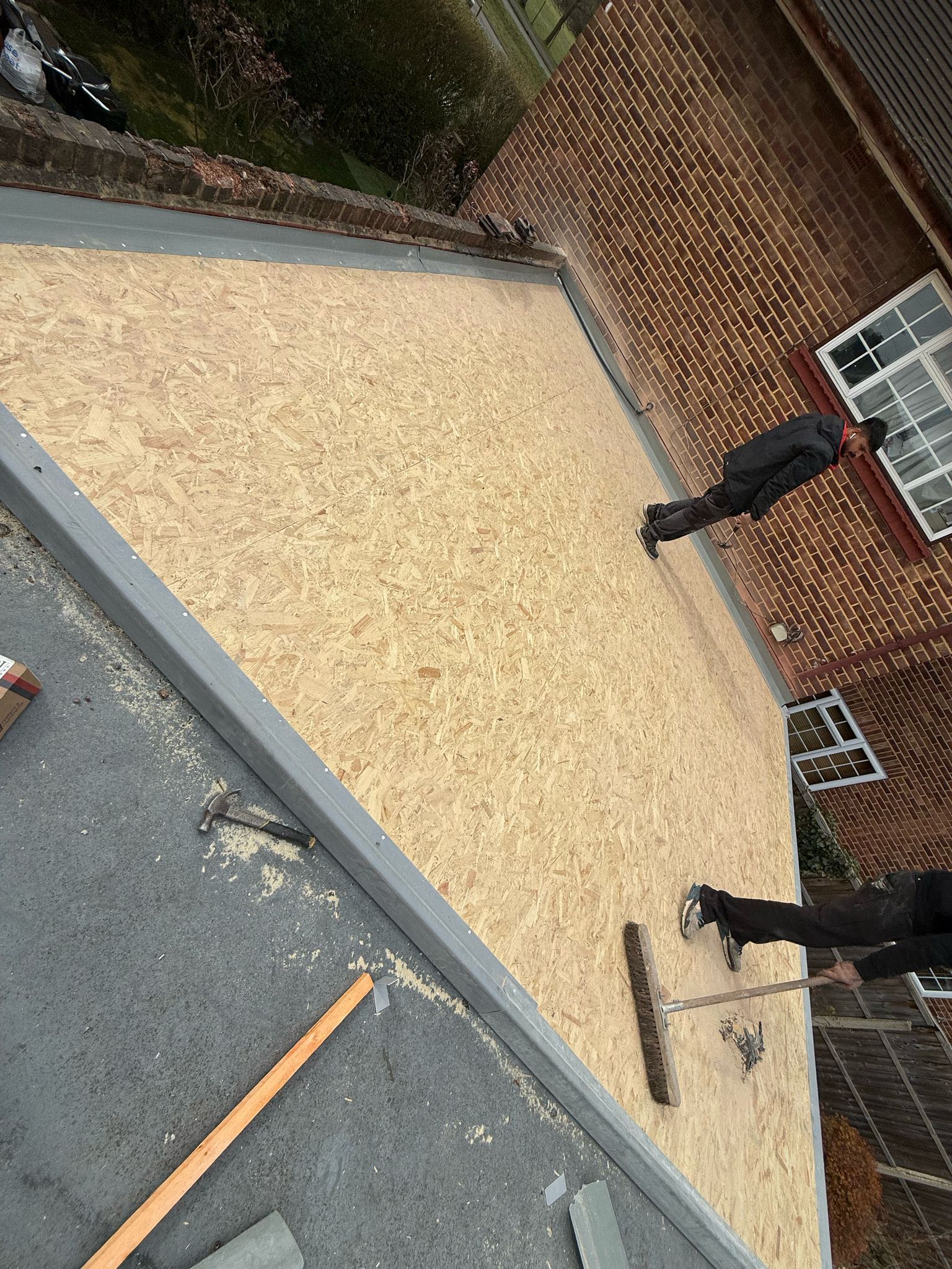 Professional roofers working on a property in London - KS Roof Master