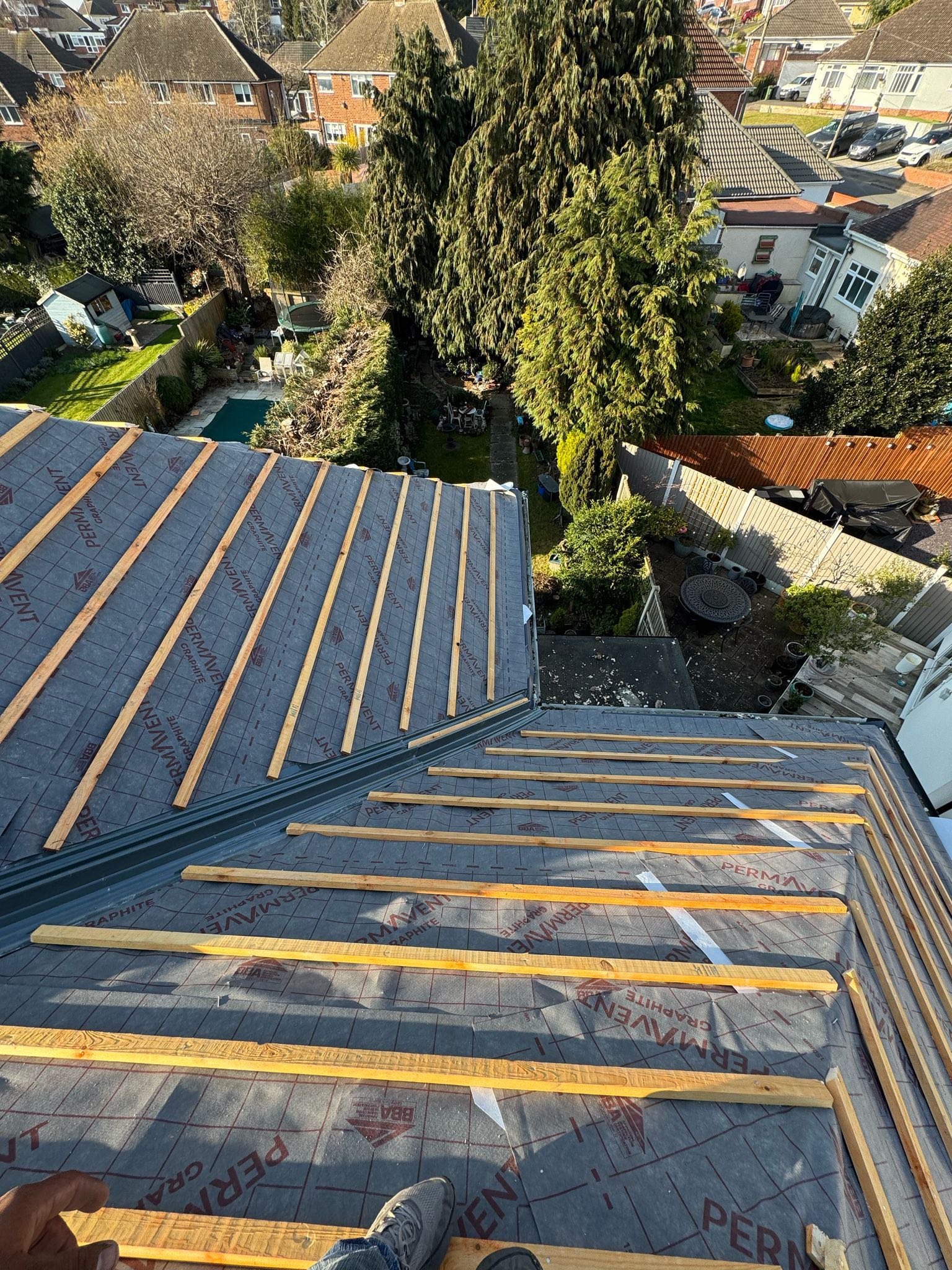 Professional roofers working on a property in London - KS Roof Master