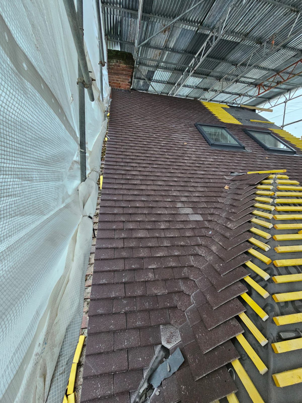 Professional roofers working on a property in London - KS Roof Master