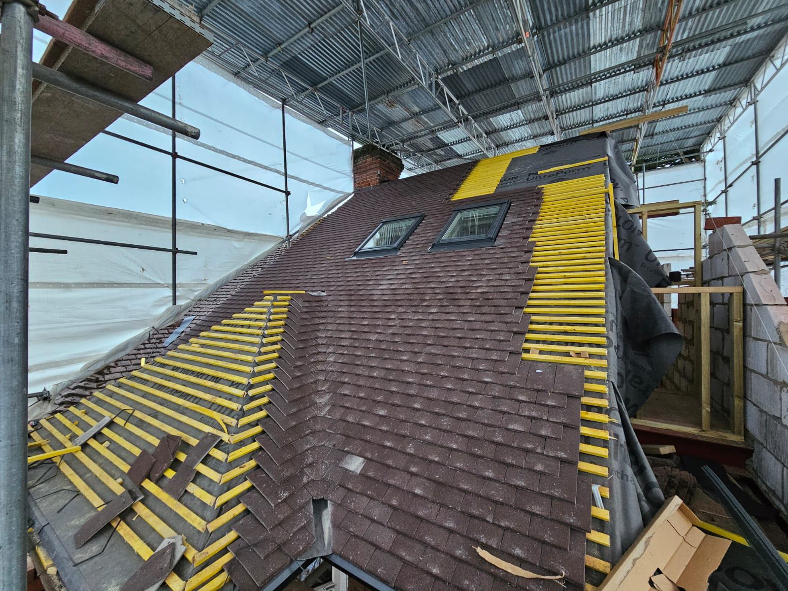 Professional roofers working on a property in London - KS Roof Master