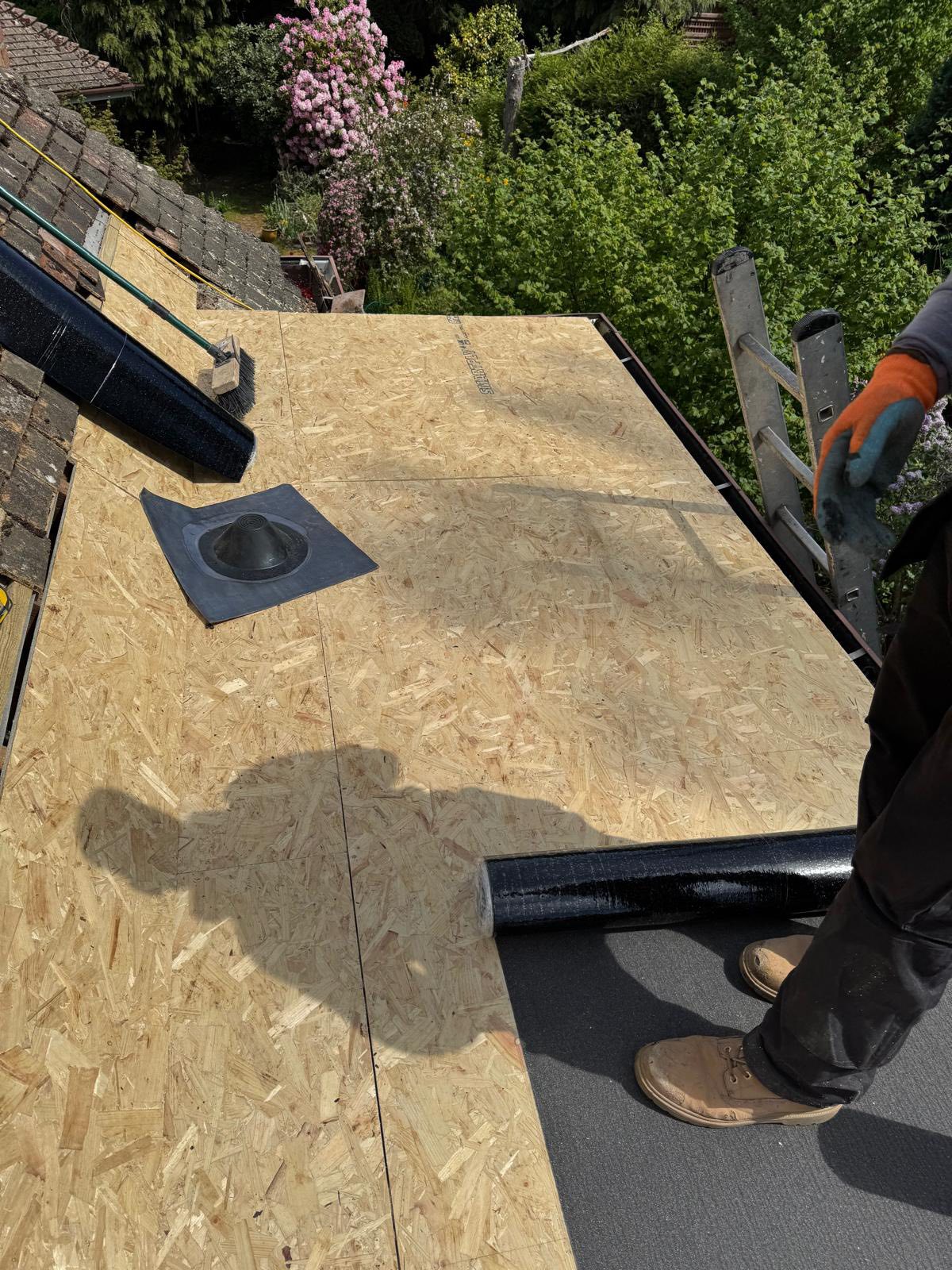 Professional roofers working on a property in London - KS Roof Master