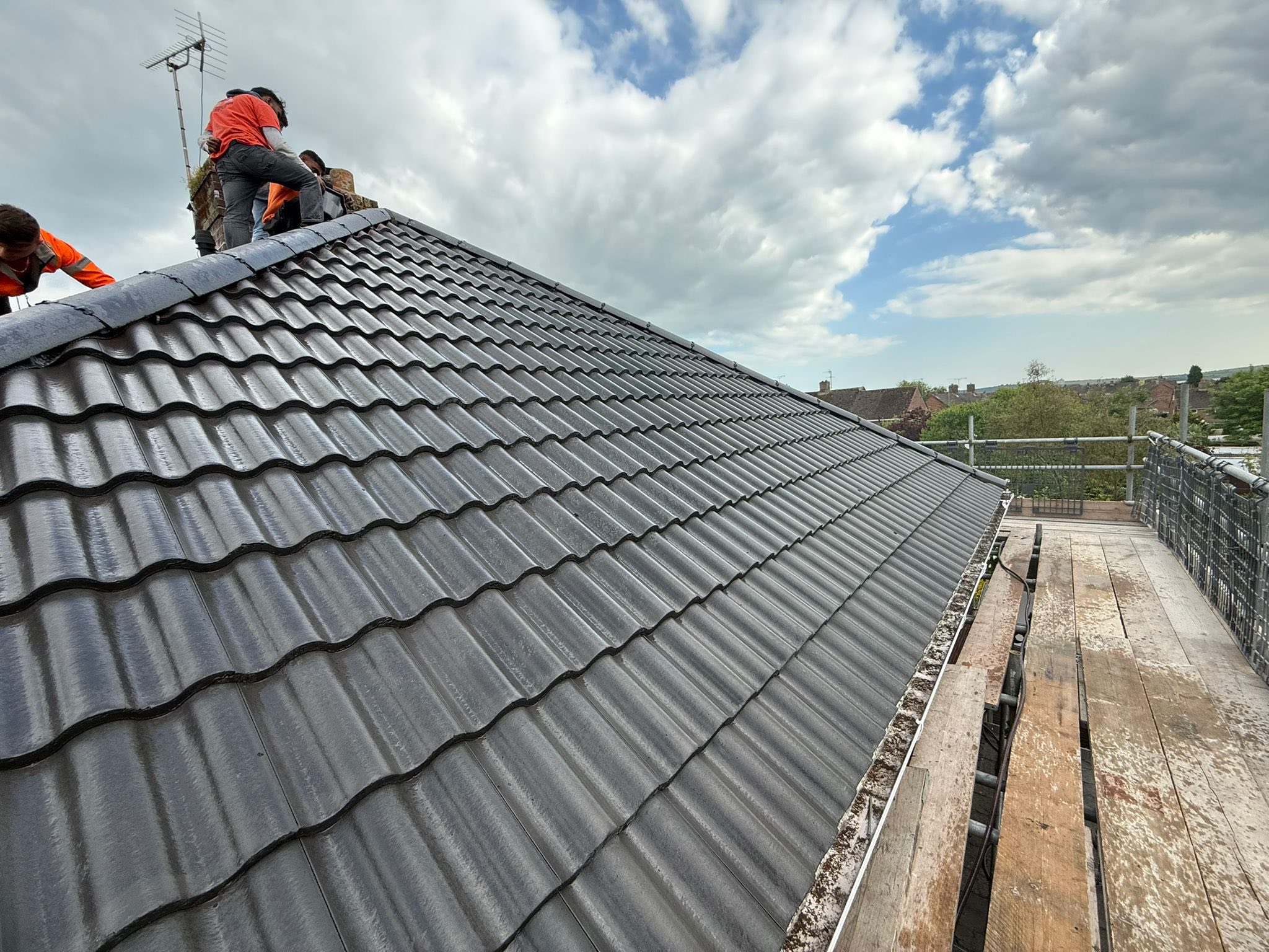 Professional roofers working on a property in London - KS Roof Master