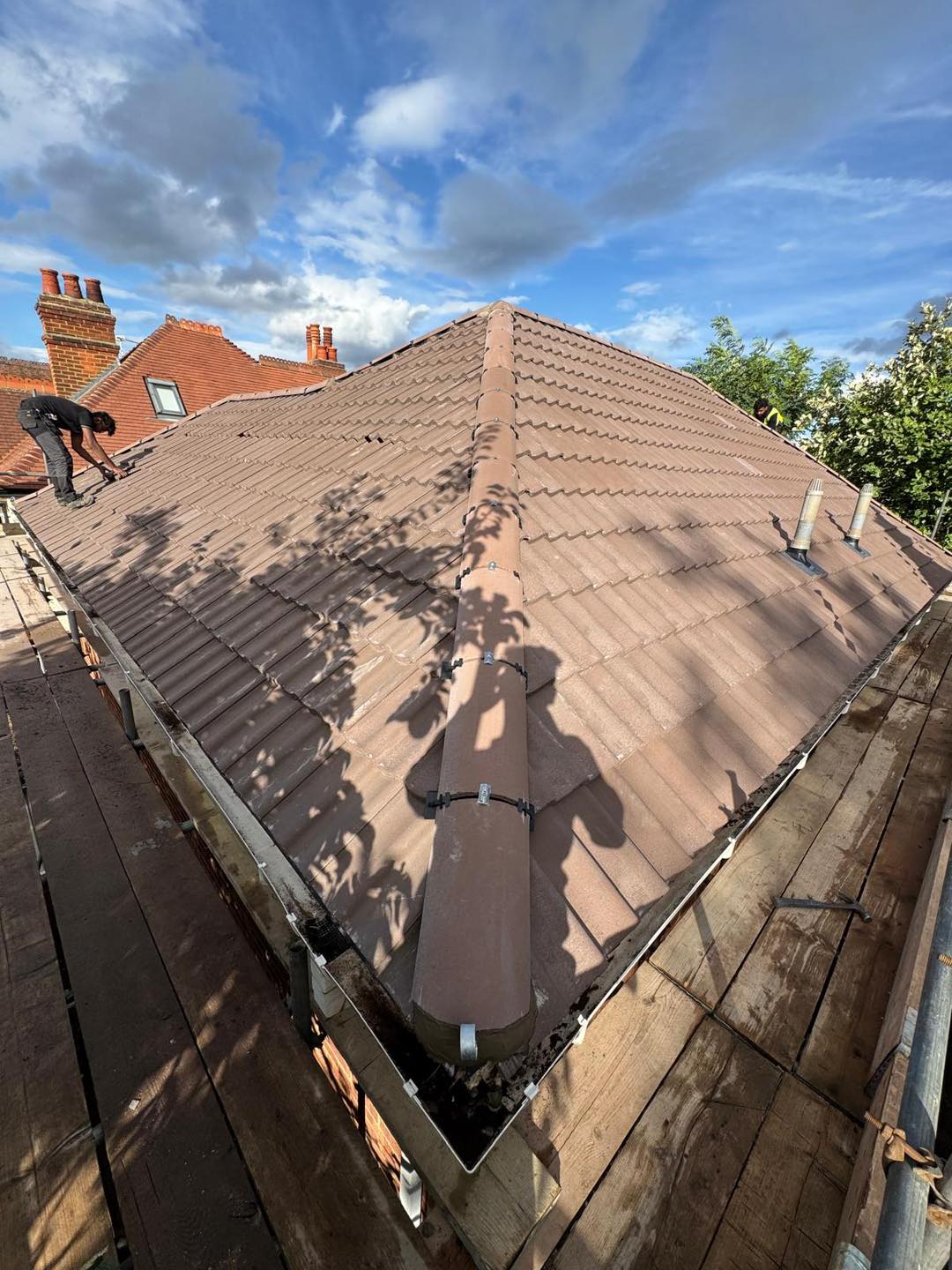 Professional roofers working on a property in London - KS Roof Master