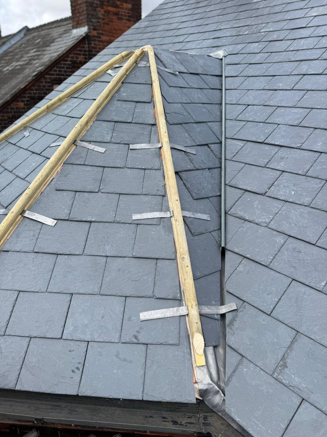 Professional roofers working on a property in London - KS Roof Master