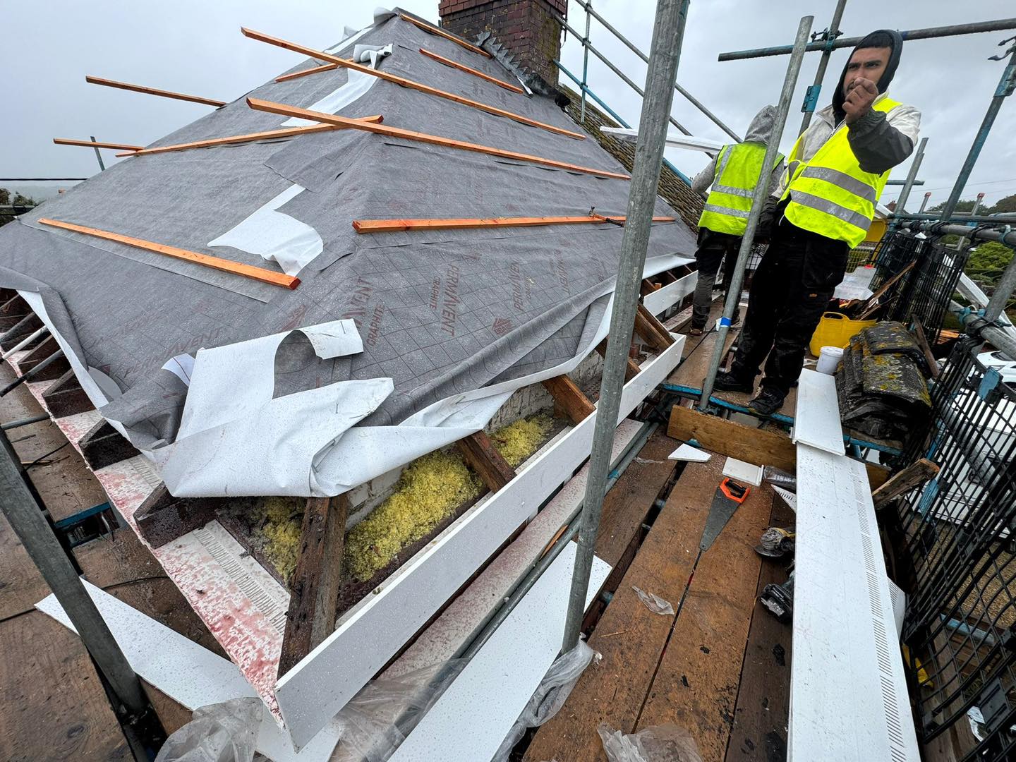 Professional roofers working on a property in London - KS Roof Master