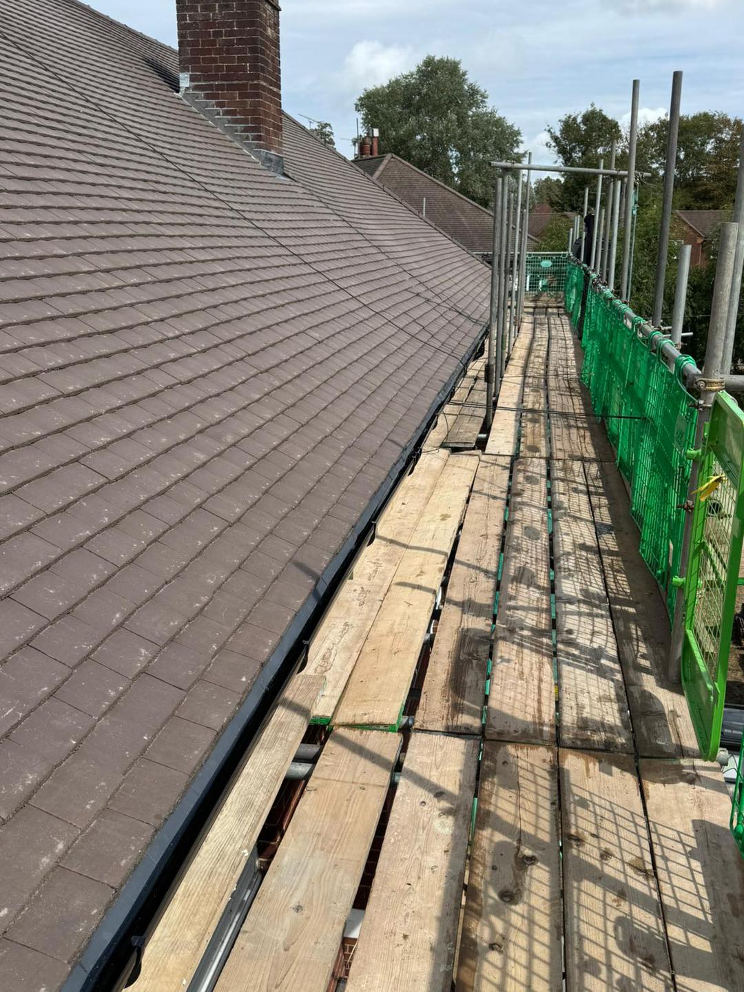 Professional roofers working on a property in London - KS Roof Master