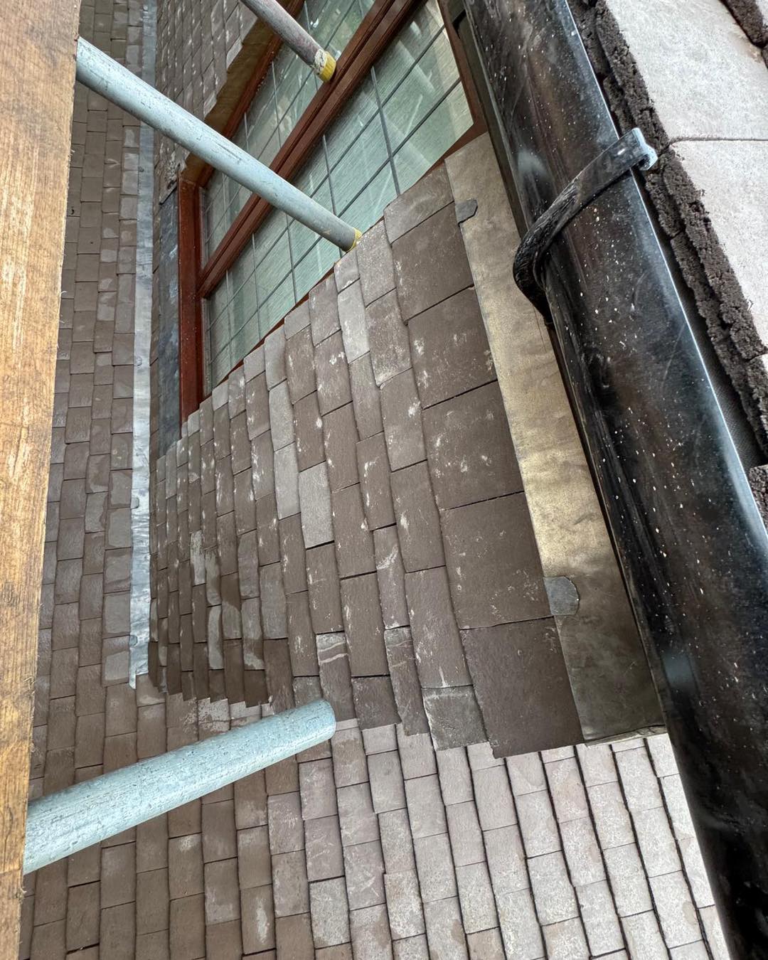 Professional roofers working on a property in London - KS Roof Master