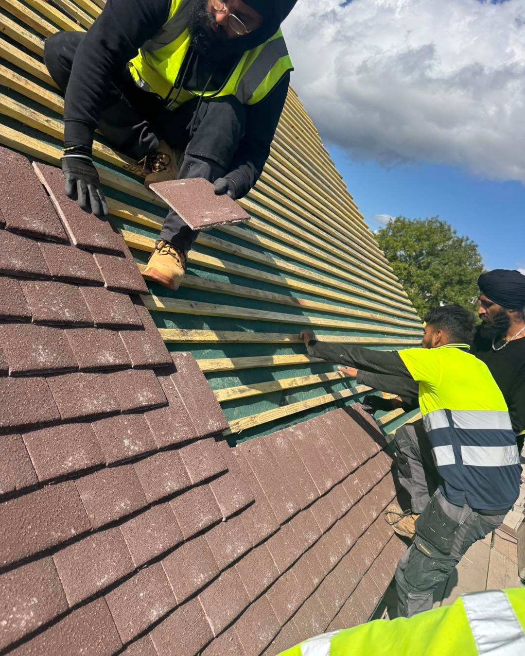Professional roofers working on a property in London - KS Roof Master