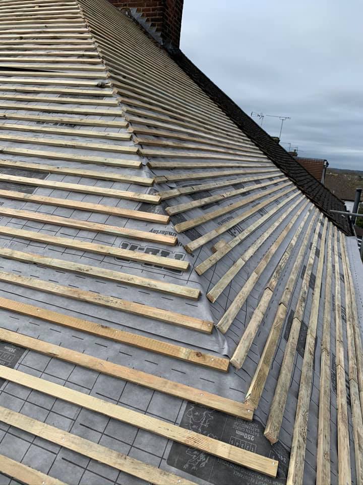 Professional roofers working on a property in London - KS Roof Master