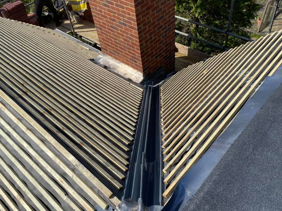 Professional roofers working on a property in London - KS Roof Master