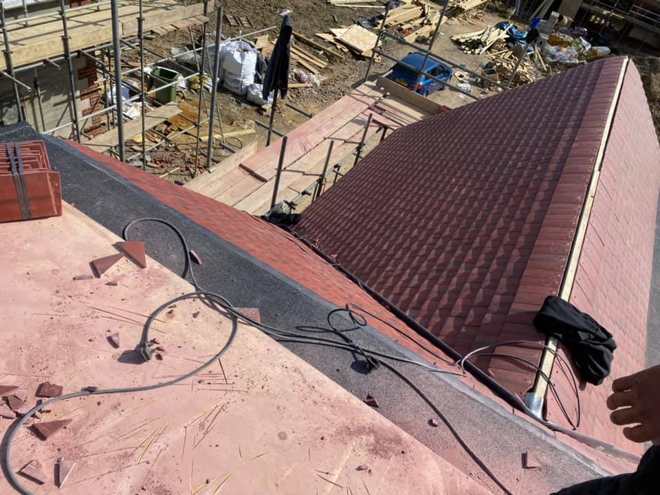 Professional roofers working on a property in London - KS Roof Master