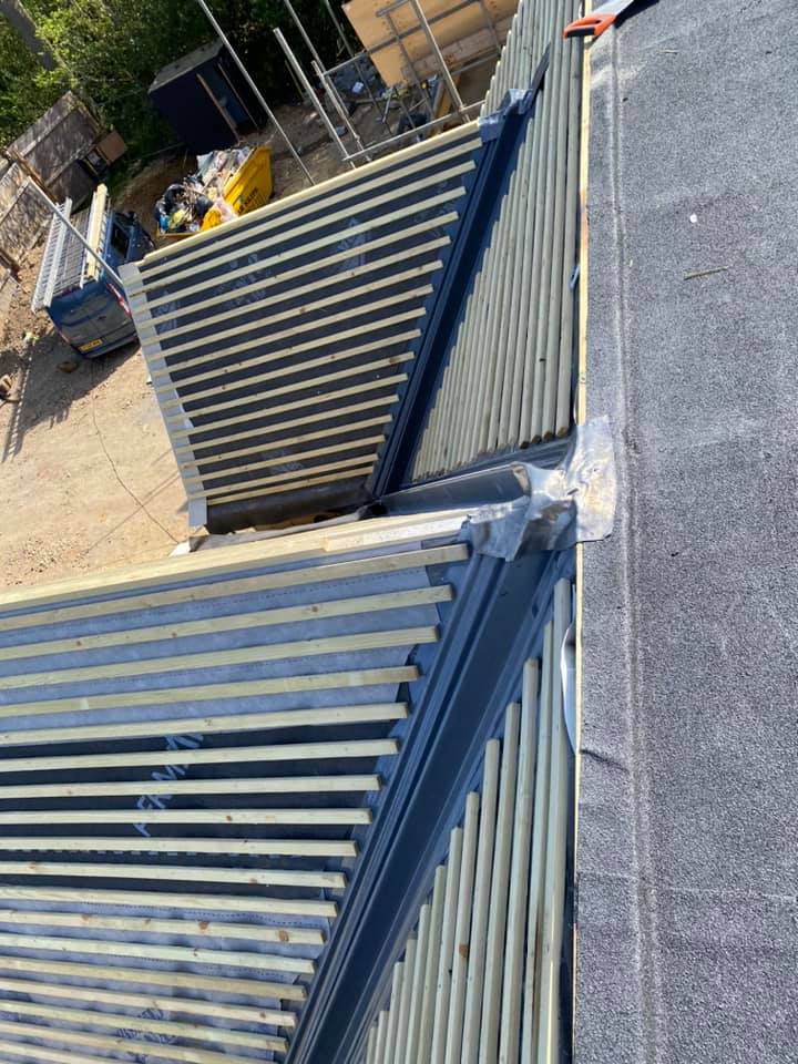 Professional roofers working on a property in London - KS Roof Master
