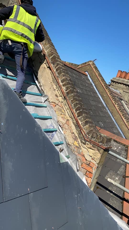 Professional roofers working on a property in London - KS Roof Master