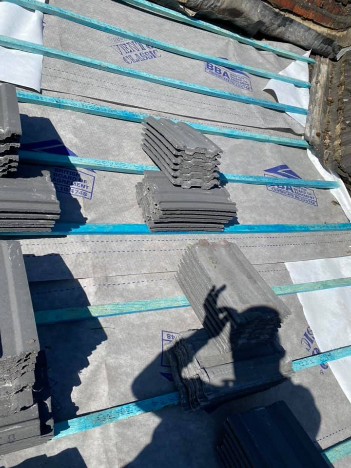 Professional roofers working on a property in London - KS Roof Master