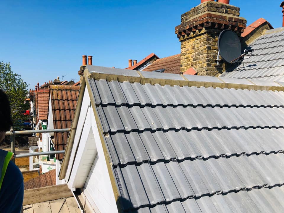 Professional roofers working on a property in London - KS Roof Master