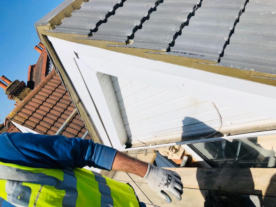 Professional roofers working on a property in London - KS Roof Master