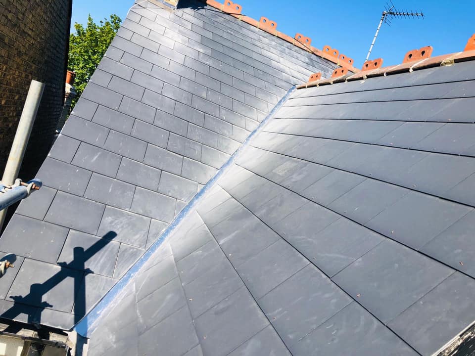 Professional roofers working on a property in London - KS Roof Master