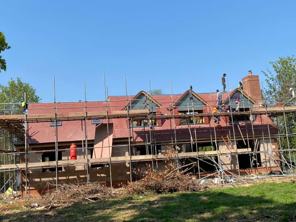 Professional roofers working on a property in London - KS Roof Master