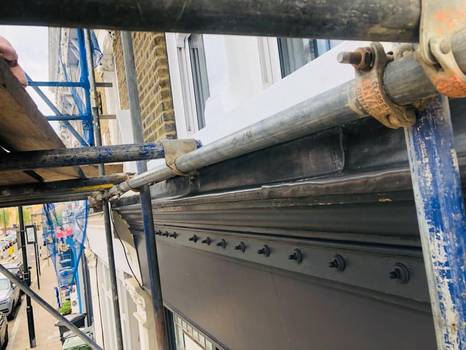 Professional roofers working on a property in London - KS Roof Master