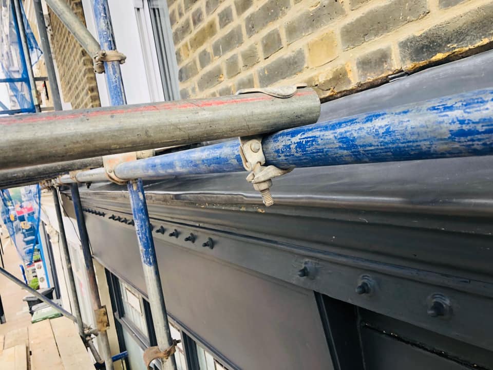 Professional roofers working on a property in London - KS Roof Master