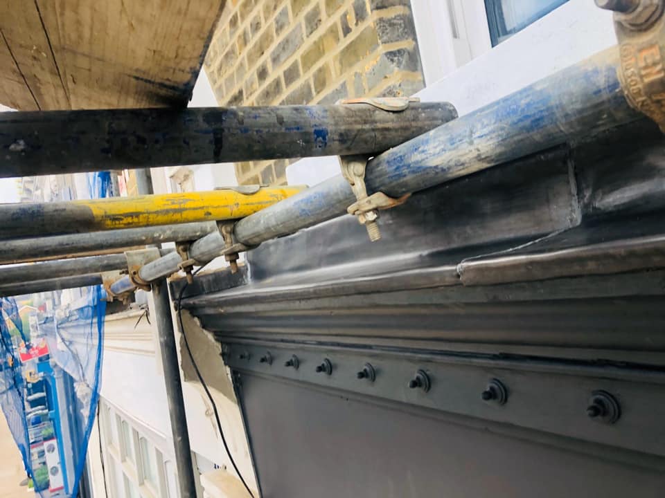 Professional roofers working on a property in London - KS Roof Master