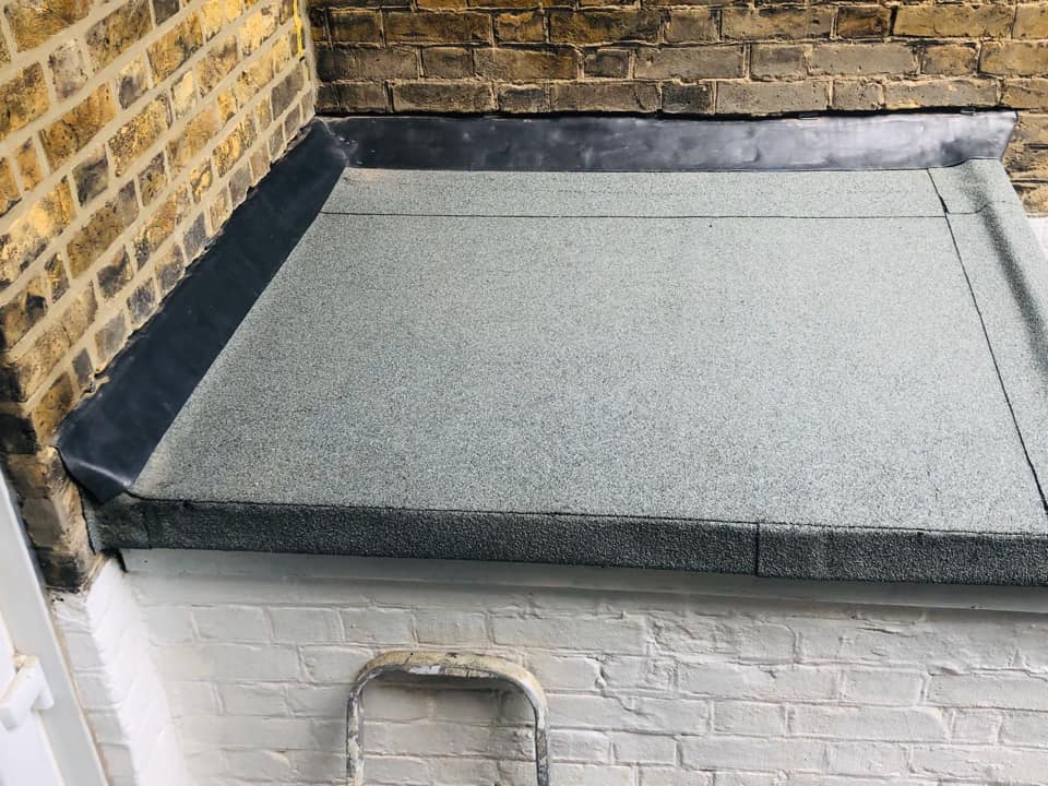Professional roofers working on a property in London - KS Roof Master