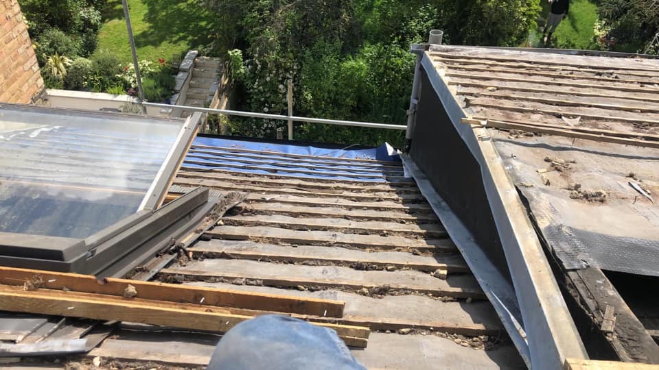 Professional roofers working on a property in London - KS Roof Master